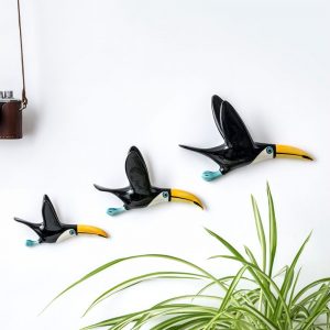 A trio of flying toucans by Hannah Turner