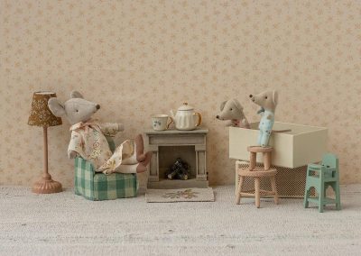 sitting room scene with family of mice and mint highchair