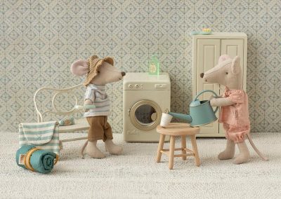 kitchen scene with washing machine and sister and brother mouse
