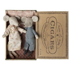 Grandma and grandpa mouse lying in a cigar box bed